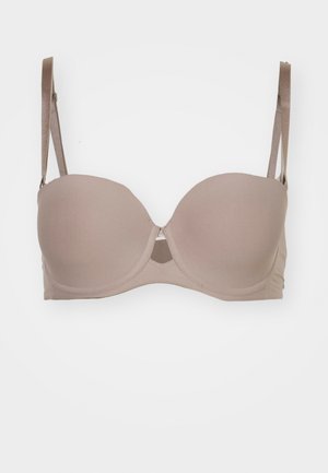 Light beige padded bra with underwire, adjustable straps, and center cutout detail. Made of smooth fabric with seamless cups.