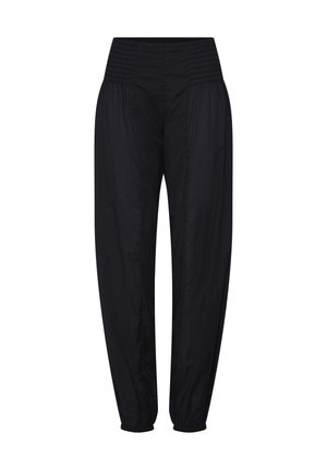 Schwarze Hose mit hohem Bund, gerafftem elastischem Bund und gesmokten, elastischen Bündchen, lockerer Sitz an den Hüften und zulaufenden Beinen.