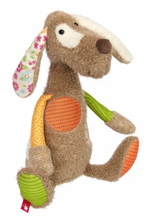 Stuffed dog toy with textured beige body, colorful patterned ears, and polka dot accents in orange, green, and pink. Features plush, floppy limbs.