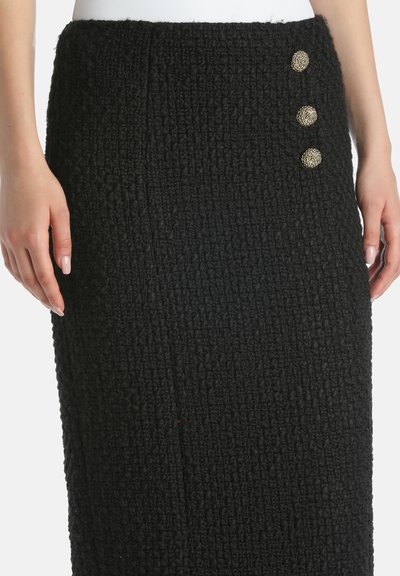 Black wool skirt with textured fabric, featuring three decorative metallic buttons on the side and a fitted design.