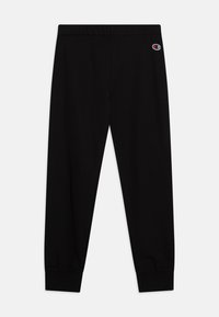 Pantalons de survêtement noirs en coton, avec une taille élastique et des poignets ajustés. Comprend un petit logo brodé sur le côté supérieur gauche.