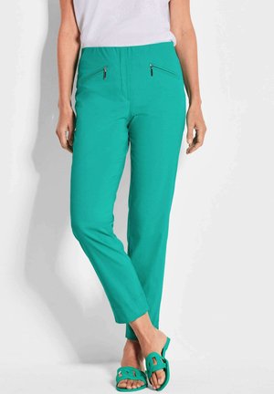 Pantaloni turchesi con una texture liscia, dotati di due tasche con zip sul davanti, design a gamba affusolata e vita comoda.