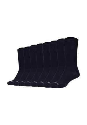 Neun Paar schwarze Knöchelsocken mit geripptem Bündchen, in einer Reihe vor weißem Hintergrund angeordnet.