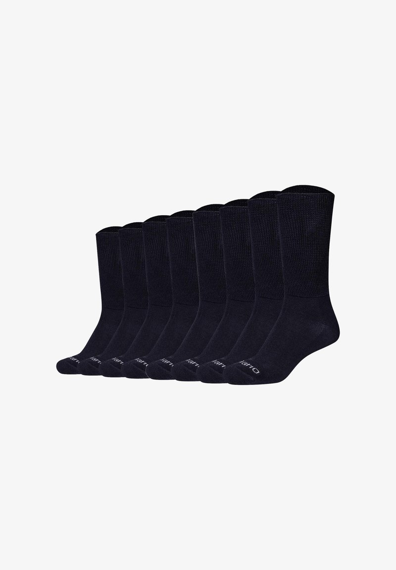Neuf paires de chaussettes noires à bord-côtes, alignées en rangée sur un fond blanc.