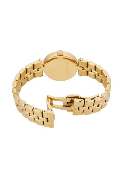 Gold-tone wristwatch with a rounded case, metallic link bracelet, push-button clasp, and engraved logo on the back.