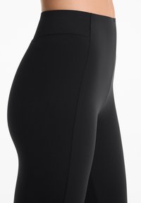 OYSHO NEOPRENE-EFFECT RISE FLARE  - Hlače - black