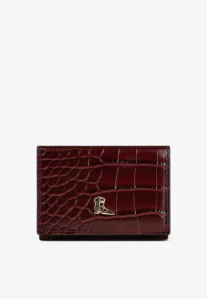 Burgundy leather wallet with croc texture, featuring a gold-tone boot-shaped accent. Compact rectangular shape, smooth finish, and stitched edges.