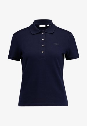 Dunkelblaues Polo-Shirt aus strukturiertem Baumwollstoff. Verfügt über einen Kragen, eine Drei-Knopf-Leiste und ein gesticktes Logo auf der Brust.