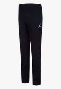 Crne sportske hlače s elastičnim pojasom, s bijelim Jumpman logotipom, zatvorenim gležnjevima i kutnim dizajnom bočnih šavova.