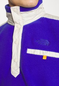 The North Face Flisinis džemperis - lapis blue/sandstone/cone orange
