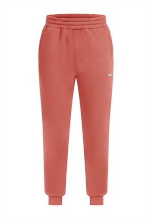 Salmonkleurige joggingbroek van zacht materiaal. Beschikt over een elastische tailleband, twee zijzakken en ribgebreide boorden bij de enkels.