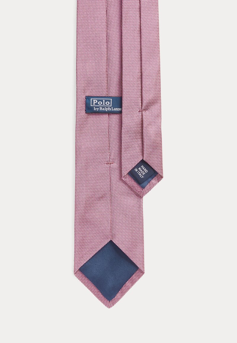 Red and white patterned silk tie with a navy blue tip, featuring a label reading "Polo by Ralph Lauren" and "Hand Made in Italy."