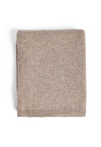 Sugniestas smėlinis megztinis, pagamintas iš minkštos mezginės medžiagos. Yra tekstūruota paviršius ir smulkūs kraštai. Kompaktiška stačiakampio formos, be matomų raštų.