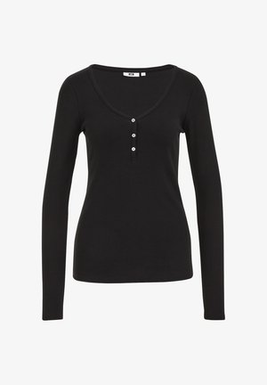 Zwarte langetermijn top van ribbelstof, met een diepe V-halslijn en een drieknoopsluiting met witte knopen. Glad oppervlak overal.