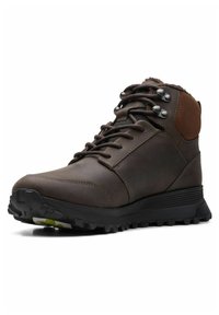 Scarponcini da trekking in pelle marrone, con colletto imbottito, occhielli in metallo e suola in gomma testurizzata con profonda scolpitura per una migliore aderenza.