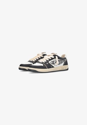 Low-top black and white sneakers with cream laces, winged star logo on sides, and beige rubber soles with decorative stitching.