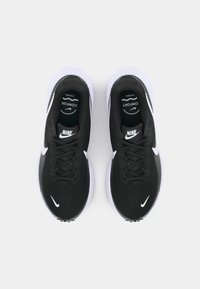 Black Nike running shoes with a textured upper, flat laces, and white logo accents; features a cushioned sole, designed for comfort.