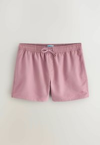 Roze kupaće kratke hlače izrađene od glatke, lagane tkanine. Imaju elastičan pojas sa vezicom i mali logotip palme na rubu.