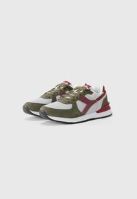 Green and gray athletic shoes with mesh and suede materials. Features red accents, textured rubber outsole, and round lace-up closure.