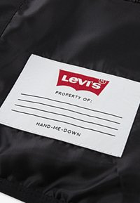Levi's® A LINE PUFFER UNISEX - Vinterjacka - black