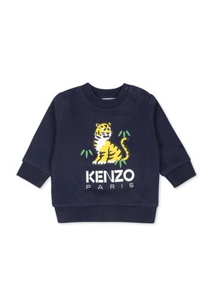 Sweat-shirt bleu marine à manches longues. Équipé d'un graphisme de tigre jaune et du texte « KENZO PARIS » en blanc. Matière en coton doux, poignets côtelés.