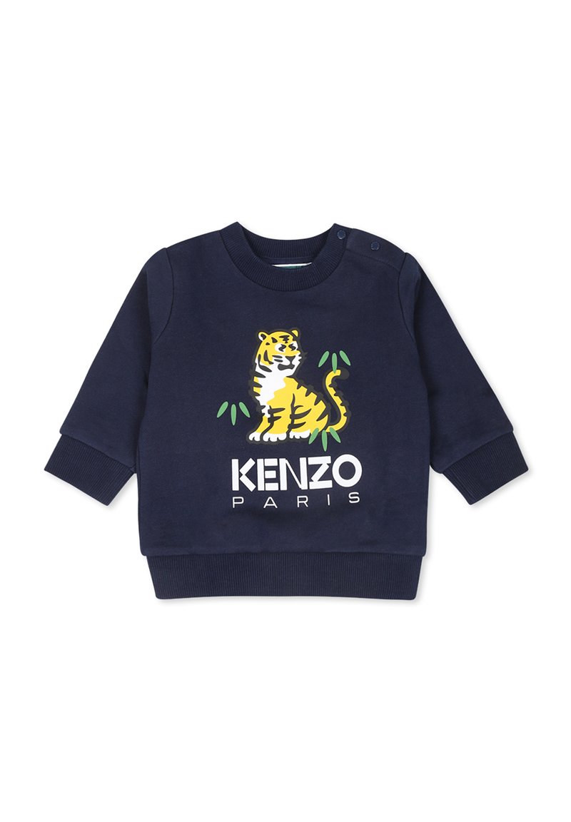 Sweat-shirt bleu marine à manches longues. Équipé d'un graphisme de tigre jaune et du texte « KENZO PARIS » en blanc. Matière en coton doux, poignets côtelés.