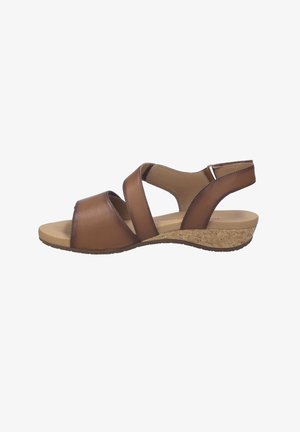 Brown leather open-toe sandal with crisscross straps, cork wedge heel, and adjustable ankle strap, shown in side profile.