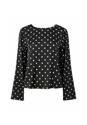 Blouse noire à manches longues avec un col rond, ornée d'un motif à pois blancs. Fabriquée dans un tissu lisse avec une coupe décontractée.