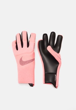 Nike gloves featuring a pink knit material with black latex palms and fingertips, designed for enhanced grip and flexibility.