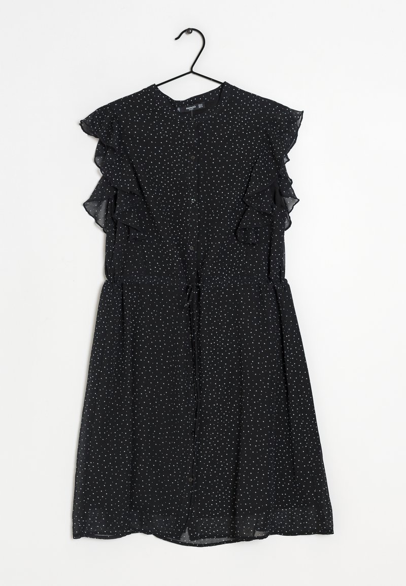 Robe noire avec des manches volantes, à pois blancs, avec un bouton sur le devant et un lien à la taille. Fabriquée en tissu léger et transparent.