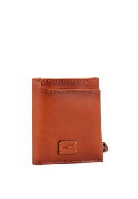 Portefeuille en cuir marron avec un design simple, une forme rectangulaire, des coutures visibles et un petit logo en relief à l'avant.