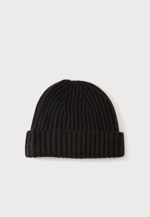 Bonnet en maille noire côtelée avec revers plié, présenté à plat sur un fond clair.
