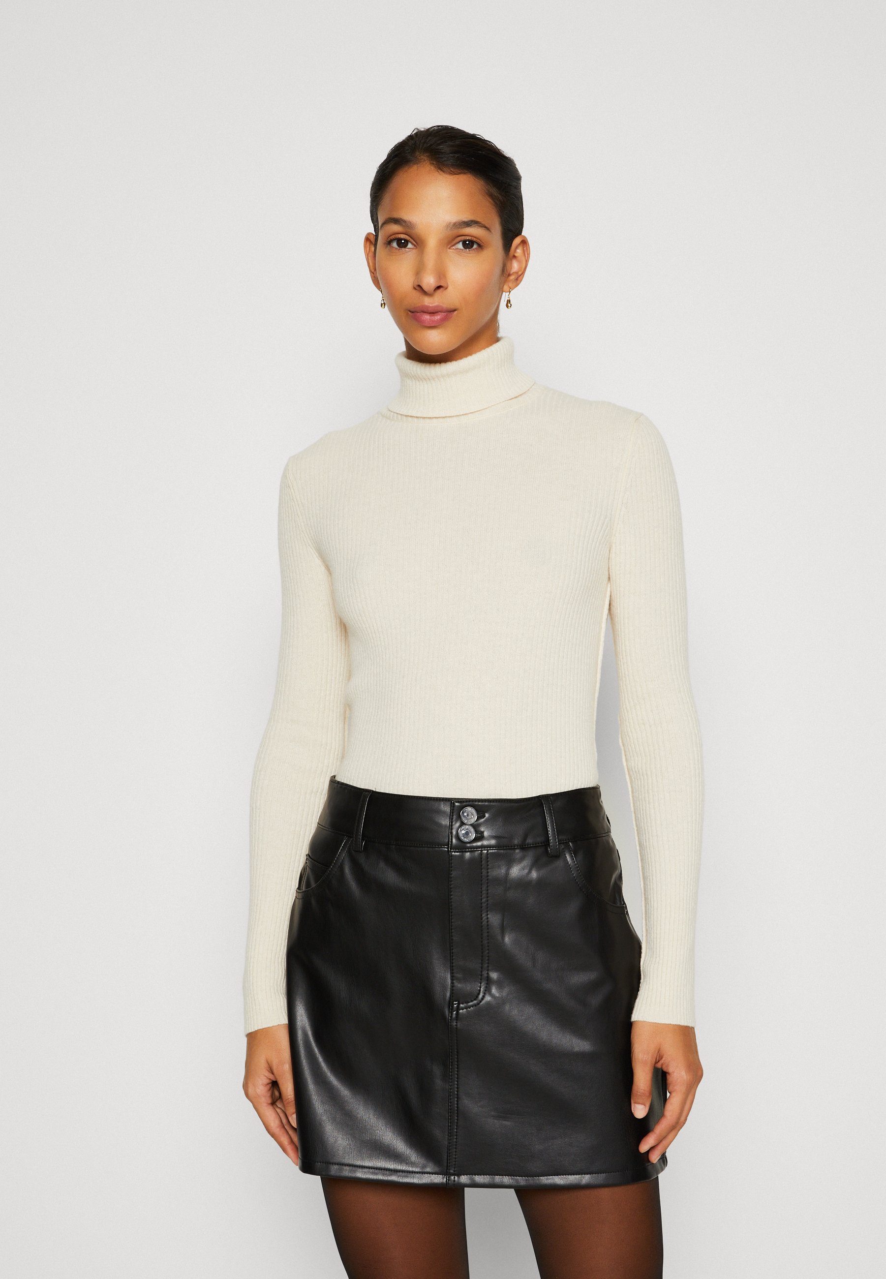 white jumper turtle neck