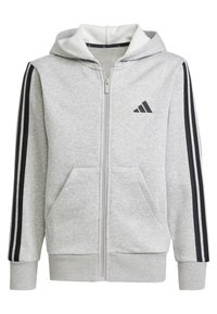 Grå zip-up hoodie med svarta ränder på ärmarna, framfickor och en mjuk, vadderad huva. Har en liten svart logotyp på bröstet.