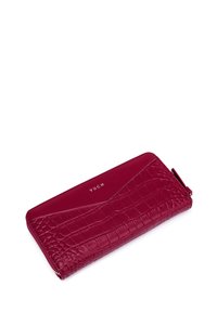Red synthetic leather wallet with croc-embossed texture, smooth accents, and a zip closure. Features a logo "VUCH" in white on the front.