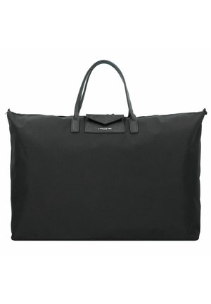 Large black tote bag made of durable fabric with leather handles and a rectangular shape. Features a zip closure and a small front pocket.