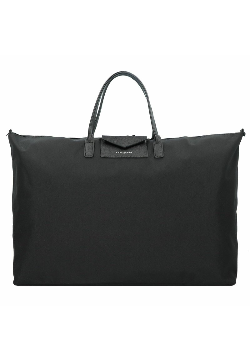 Grand sac fourre-tout noir en tissu résistant avec des poignées en cuir et une forme rectangulaire. Comprend une fermeture éclair et une petite poche avant.
