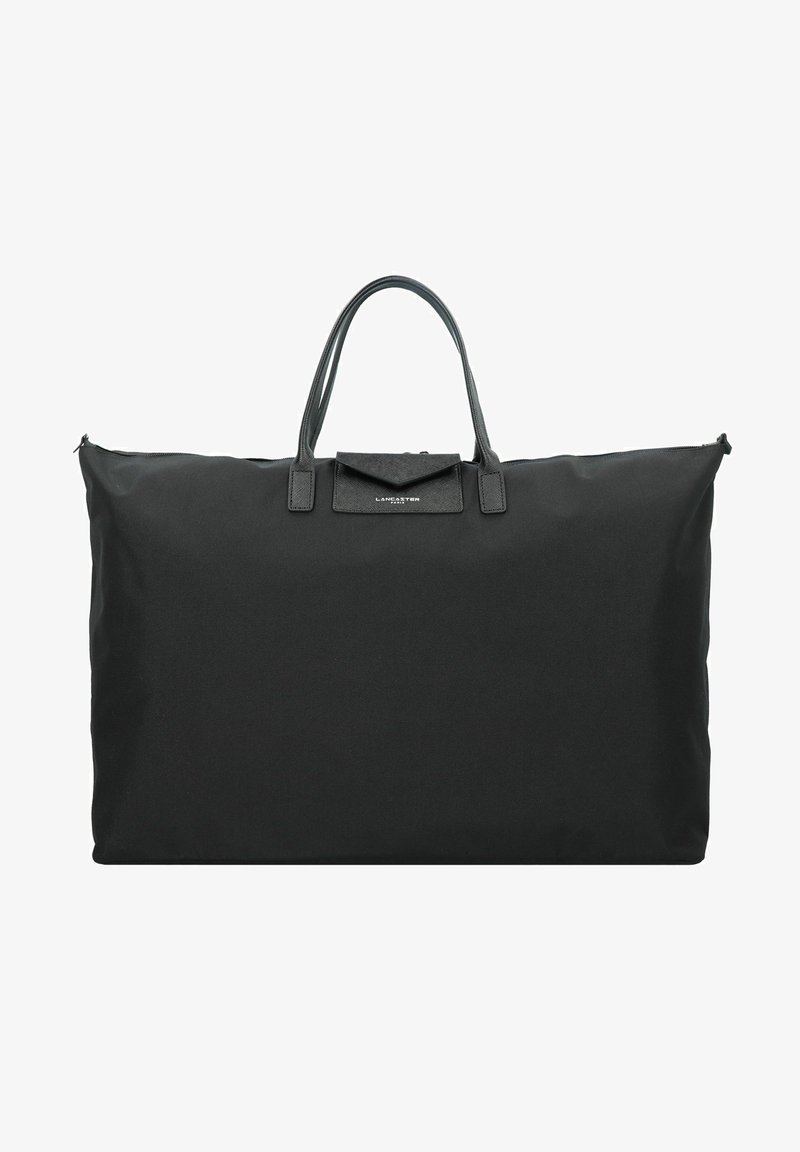 Grand sac fourre-tout noir en tissu résistant avec des poignées en cuir et une forme rectangulaire. Comprend une fermeture éclair et une petite poche avant.