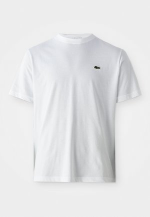 White cotton t-shirt with a crew neck, short sleeves, and a small green crocodile logo on the left chest. Smooth texture.