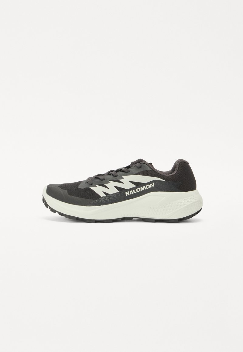 Black running shoe with gray accents, mesh upper, cushioned white midsole, textured black rubber outsole, and reflective logo detail.