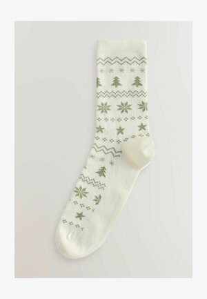 Calcetines de punto en color blanco roto con patrones festivos en verde, que incluyen árboles, estrellas y líneas en zigzag. Textura suave, diseño de longitud media.