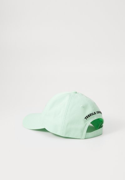 Mint green cap with a curved brim, adjustable strap, and black "TEQUILA SUNRISE" text on the back. Cotton material with a smooth texture.