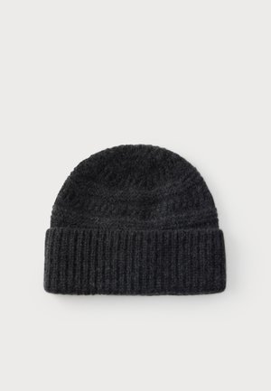 Bonnet en laine noire tricotée avec un revers côtelé plié, présenté à plat sur fond blanc.