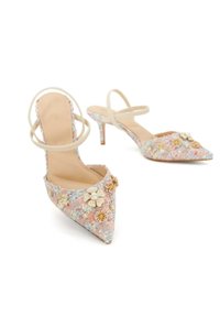Pointed-toe slingback heels with pastel floral-patterned fabric, adorned with flowers and pearls, featuring a slender heel and cross straps.