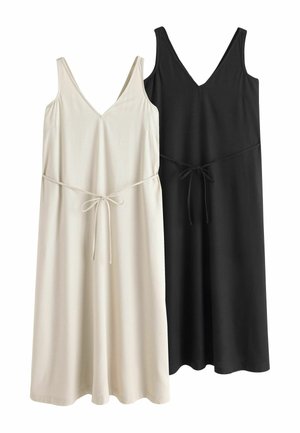 Dos vestidos midi sin mangas con escote en V y cintas en la cintura, uno en beige y el otro en negro, mostrados uno al lado del otro sobre un fondo blanco.