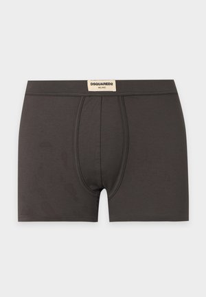 Boxers pour hommes gris foncé avec couture à l'avant et une étiquette blanche sur la taille indiquant "DSQUARED2 Milano" sur fond blanc.