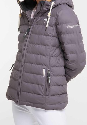 Purple quilted jacket with hood, white drawstrings, zippered pockets, and printed text on chest and sleeve, worn with white pants.