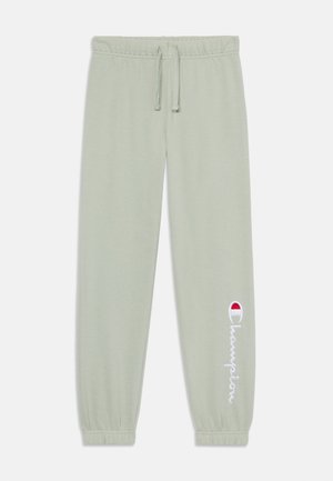 Light green joggers made of soft cotton, featuring an elastic waistband with drawstring, tapered cuffs, and a white "Champion" logo on the side.