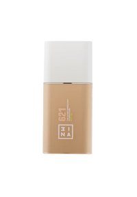 Botella de base con un cuerpo marrón mate y una tapa blanca brillante. La etiqueta presenta el nombre del producto en texto blanco y amarillo brillante. Forma cilíndrica y elegante.