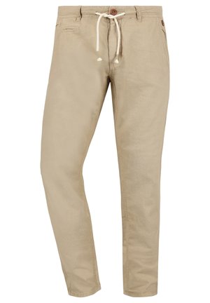 Beige chinos with a relaxed fit, made of lightweight cotton, featuring a drawstring waist, side pockets, and a single back pocket.